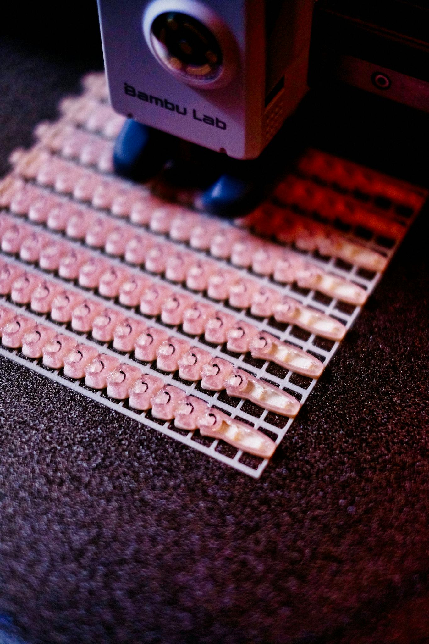 3D printer meticulously crafting intricate plastic parts with precision.